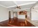 Open living space with hardwood floors and a view into the kitchen at 700 Island Way # 106, Clearwater Beach, FL 33767