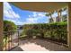 Spacious patio with a view of lush landscaping and parking at 700 Island Way # 106, Clearwater Beach, FL 33767