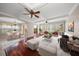 Bright and airy living room featuring hardwood floors, ample windows, and modern decor at 700 Island Way # 106, Clearwater Beach, FL 33767