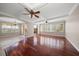 Bright and airy living room featuring hardwood floors, ample windows, and modern decor at 700 Island Way # 106, Clearwater Beach, FL 33767