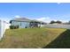 Large backyard with home view and fence at 8852 Prairie Creek Dr, New Port Richey, FL 34655