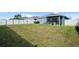 Large backyard with home and fence at 8852 Prairie Creek Dr, New Port Richey, FL 34655