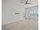 Spacious bedroom with large window and ceiling fan at 8852 Prairie Creek Dr, New Port Richey, FL 34655