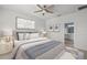 Spacious bedroom with ensuite bathroom and ceiling fan at 8852 Prairie Creek Dr, New Port Richey, FL 34655