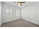 Bright bedroom with two windows and carpeted floor at 8852 Prairie Creek Dr, New Port Richey, FL 34655