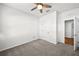 Spacious bedroom with ceiling fan and carpeting at 8852 Prairie Creek Dr, New Port Richey, FL 34655