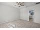 Large bedroom with plush carpet and ceiling fan at 8852 Prairie Creek Dr, New Port Richey, FL 34655