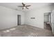 Bright bedroom with ceiling fan and access to bathroom at 8852 Prairie Creek Dr, New Port Richey, FL 34655