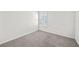 Bedroom with window and carpeted floor at 8852 Prairie Creek Dr, New Port Richey, FL 34655