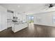 Modern kitchen with white cabinets, granite countertops, and island at 8852 Prairie Creek Dr, New Port Richey, FL 34655