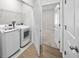 Laundry room with washer, dryer, and built-in shelving at 8852 Prairie Creek Dr, New Port Richey, FL 34655