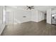Spacious living room with wood-look flooring and ample natural light at 8852 Prairie Creek Dr, New Port Richey, FL 34655