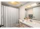 Clean bathroom with shower/tub combo, vanity, and updated fixtures at 4323 Sussex St, Holiday, FL 34691