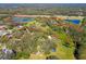 Aerial view of property with pond and highway access at 1810 Curry Rd, Lutz, FL 33549