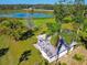 Aerial view of home on a large lot near a lake at 1810 Curry Rd, Lutz, FL 33549