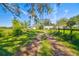 Ranch style home with detached garage, long driveway and fenced pasture at 1810 Curry Rd, Lutz, FL 33549