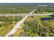 Aerial view of highway interchange and surrounding land at 1810 Curry Rd, Lutz, FL 33549