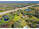 Aerial view of property with pond, home and highway access at 1810 Curry Rd, Lutz, FL 33549