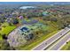 Aerial view of property with pond and highway access at 1810 Curry Rd, Lutz, FL 33549