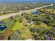 Aerial view showing property near pond and highway at 1810 Curry Rd, Lutz, FL 33549