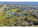 Aerial view showing property near pond and highway at 1810 Curry Rd, Lutz, FL 33549