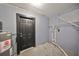 Laundry room with water heater and shelving at 664 Frederica Ln, Dunedin, FL 34698