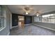 Bonus room with tile floors, ceiling fans, and a view of the backyard at 664 Frederica Ln, Dunedin, FL 34698