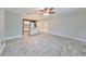 Spacious living room with tile flooring and an open view of the kitchen at 664 Frederica Ln, Dunedin, FL 34698