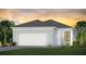 Single-story home with two-car garage and a welcoming facade at 18906 Indian Rock Pl, Lakewood Ranch, FL 34211