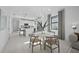 Casual dining area with white round table and view of the kitchen at 18906 Indian Rock Pl, Lakewood Ranch, FL 34211