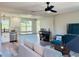 Open living space with kitchen, island, and teal accent chair at 2658 48Th S St, Gulfport, FL 33711