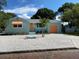Newly renovated light teal home with orange garage door at 2658 48Th S St, Gulfport, FL 33711