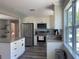 Updated kitchen featuring white shaker cabinets, stainless steel appliances, and gray countertops at 2658 48Th S St, Gulfport, FL 33711