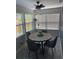 Bright dining area with a round table and four chairs, featuring patterned tile flooring at 2658 48Th S St, Gulfport, FL 33711