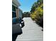 Relaxing backyard deck with gray composite planks and wicker seating at 2658 48Th S St, Gulfport, FL 33711