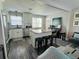 Modern kitchen with white cabinets, stainless steel appliances, and an island at 2658 48Th S St, Gulfport, FL 33711