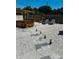 Hot tub with wooden pergola and surrounding gravel landscaping at 2658 48Th S St, Gulfport, FL 33711