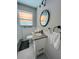 Stylish bathroom with hexagon floor tile and modern fixtures at 2658 48Th S St, Gulfport, FL 33711