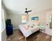 Spacious main bedroom with a king-size bed, blue dresser, and light flooring at 2658 48Th S St, Gulfport, FL 33711