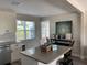 Eat-in kitchen with white cabinets, stainless steel appliances and an island at 2658 48Th S St, Gulfport, FL 33711