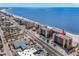 Aerial perspective highlighting the condo building's beachfront location and street access at 14900 Gulf Blvd # 410, Madeira Beach, FL 33708