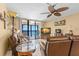 Relaxing living room with leather furniture and stunning ocean view at 14900 Gulf Blvd # 410, Madeira Beach, FL 33708