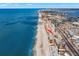 Aerial view showcasing condo's beachfront location and surrounding cityscape at 14900 Gulf Blvd # 410, Madeira Beach, FL 33708