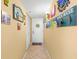 Bright and beachy condo entryway with decorative wall art at 14900 Gulf Blvd # 410, Madeira Beach, FL 33708