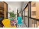 Relaxing balcony with colorful chairs and ocean view at 14900 Gulf Blvd # 410, Madeira Beach, FL 33708