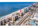 Aerial view of beachfront condo building, highlighting its location and proximity to the ocean at 14900 Gulf Blvd # 410, Madeira Beach, FL 33708