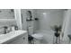 Updated bathroom with marble tile and modern fixtures at 2261 Swedish Dr # 59, Clearwater, FL 33763