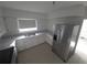 This kitchen features white cabinetry and stainless steel appliances under ample natural light at 3102 W Leroy St # A, Tampa, FL 33607