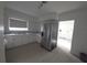 Bright kitchen featuring white cabinetry, stainless steel appliances, and a convenient layout at 3102 W Leroy St # A, Tampa, FL 33607