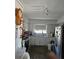 Functional kitchen with white cabinetry, stainless steel refrigerator, and vintage wall clock at 3102 W Leroy St # A, Tampa, FL 33607